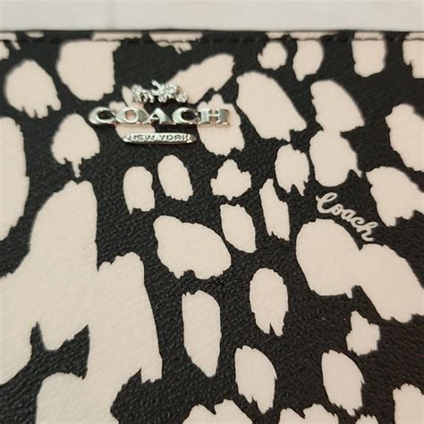 coach cow print purse.